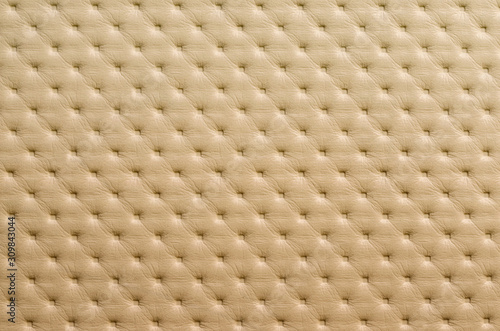 Beige leather pattern with rhombus retro ornament. Textured background