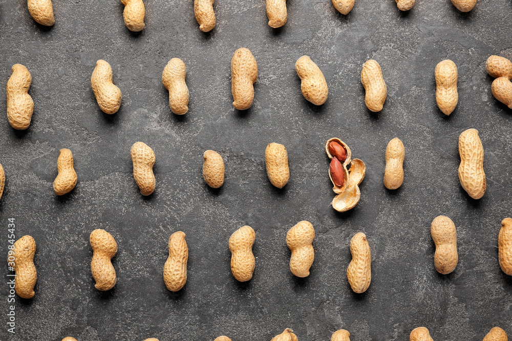 Tasty peanuts on dark background Tasty peanuts on dark background