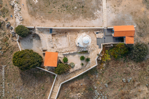 Paphos Lighthouse, Cyprus, aerial view from drone. Located in Paphos archeological park on mediterranean seaside or coast, built in 1888.