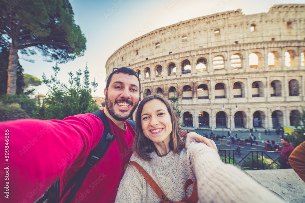 happy handsome tourist couple taking selfie in Rome, capital of Italy