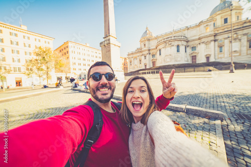 Canvas Print happy handsome tourist couple taking selfie in Rome, capital of Italy