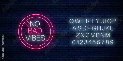 No bad vibes - glowing neon phrase in red warning circle with alphabet. Motivation quote in neon style.