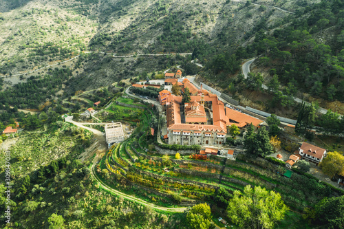 Aerial view of ancient Machairas Monastery in Cyprus Mountains. Beautiful view of old religious mediterranean architecture in green nature landscape. photo