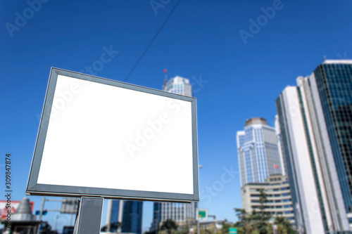 Close-up advertising sign. In white background. Photographed on a summer day.