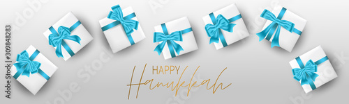 Happy Hanukkah. Traditional Jewish holiday. Chankkah banner or website header background design concept. Judaic religion decor with white luxury gift boxes with blue ribbon. Vector illustration. photo