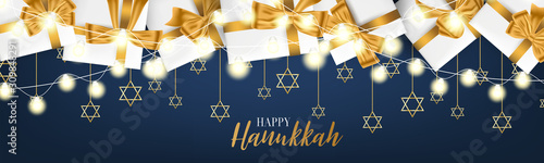 Happy Hanukkah. Traditional Jewish holiday. Chankkah banner or website header background design concept. Judaic religion decor with white luxury gift boxes with golden ribbon. Vector illustration. photo