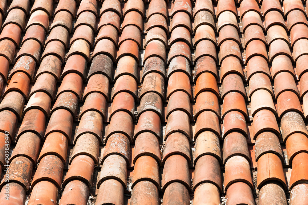 Background with the tiled roof. Old red rustic tiles. Background with the tiled roof. Old red rustic tiles.