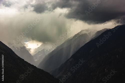 Cloud and rains over the steep ridges of the Annapurna mountains in the Nepal Himalaya.