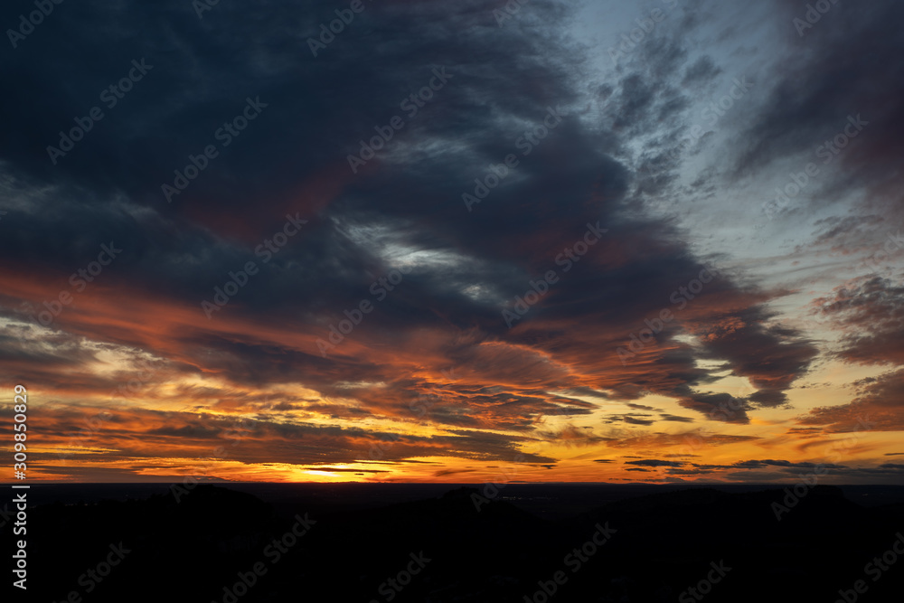 Sunset or Sunrise sky with orange and yellow colors. With beautiful clouds, perfect for sky replacement.