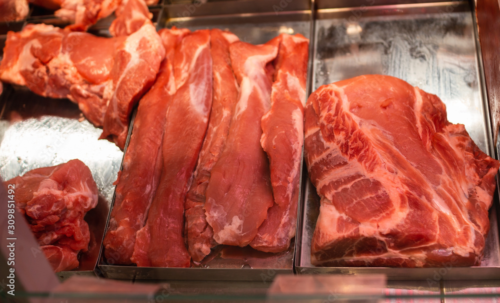 Raw red meat on shelf in supermarket