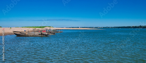 Vászonkép Fishing boats on a beach at Kaoh Trung, an island in the Mekong River near Krati