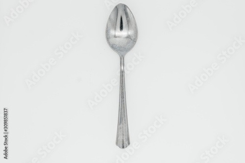 Spoon on white background close-up