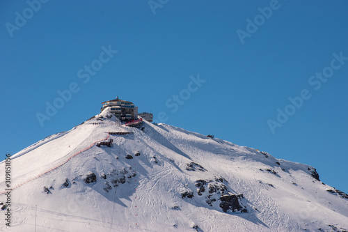 Swiss mountain peak after snowfall with panoramic view of Murren Jungfrau ski region.