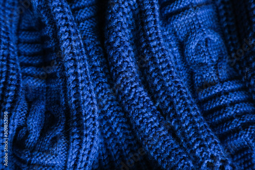  Classic blue dark knitted background. Close up texture . wrinkled and shadows, top view. 2020 trend color