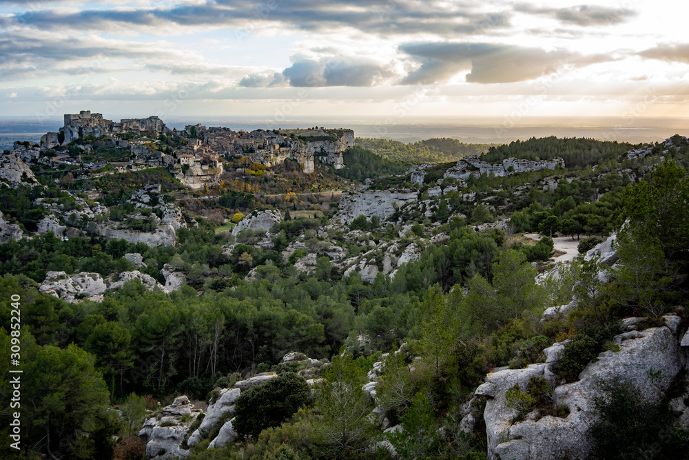 View of the Baux de Provence at sunset from a vantage point in the Alpilles at sunset, south of France.