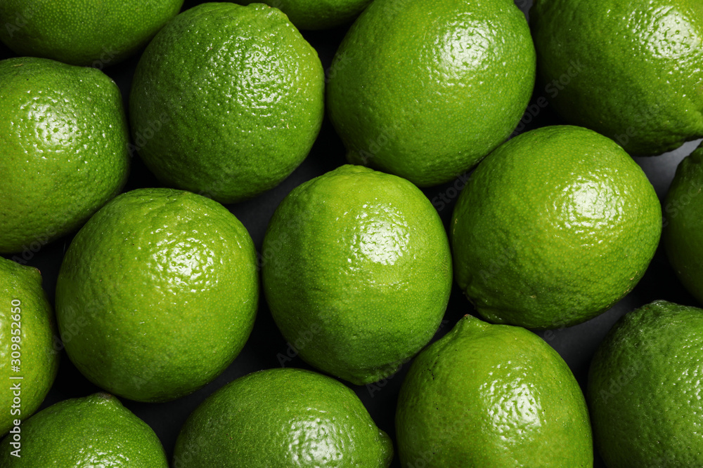 Fresh ripe green limes as background, top view Fresh ripe green limes as background, top view