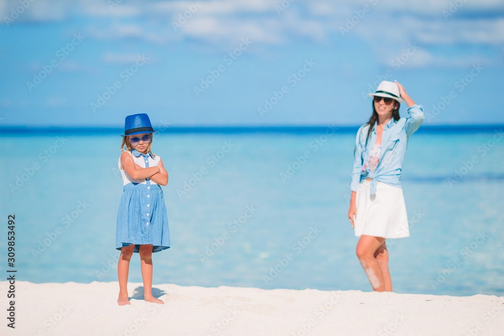 Beautiful mother and daughter on the beach Beautiful mother and daughter on the beach