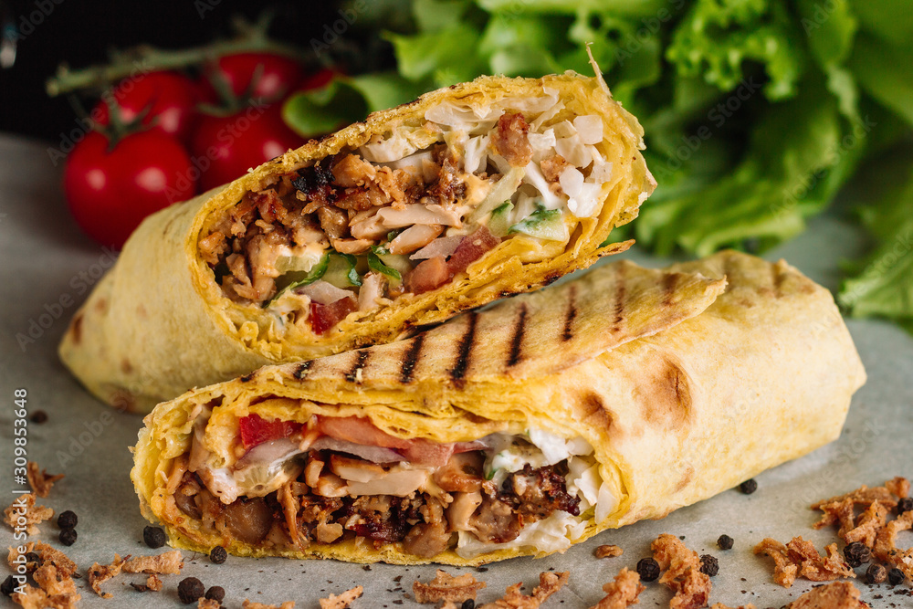 Shawarma sandwich gyro fresh roll of lavash pita bread chicken beef  shawarma falafel RecipeTin Eatsfilled with grilled meat, mushrooms, cheese.  Traditional Middle Eastern snack. On wooden background Stock Photo | Adobe  Stock