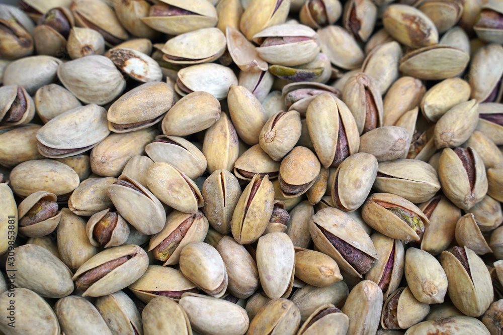 Background of shell pistachios situated arbitrarily. Top view
