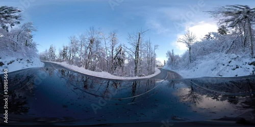VR360 Car driving on a snowy road on a sunny winter day