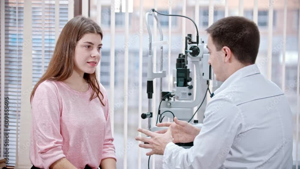 Ophthalmology treatment in the cabinet - young woman having a consultation with an optometry doctor Ophthalmology treatment in the cabinet - young woman having a consultation with an optometry doctor