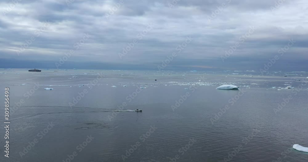 4k Video of Icebergs and ice from melting glacier in icefjord in Ilulissat, Greenland. Global Warming and Climate Change. Aerial video of arctic nature ice landscape. Unesco World Heritage Site. 4k Video of Icebergs and ice from melting glacier in icefjord in Ilulissat, Greenland. Global Warming and Climate Change. Aerial video of arctic nature ice landscape. Unesco World Heritage Site.