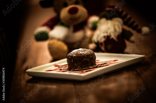 Christmas sweets in rustic cafeteria environment. Typical South American sweet known as gingerbread. Christmas decoration with chocolate candy.