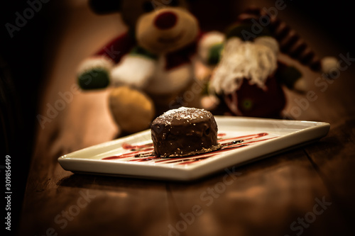 Christmas sweets in rustic cafeteria environment. Typical South American sweet known as gingerbread. Christmas decoration with chocolate candy.