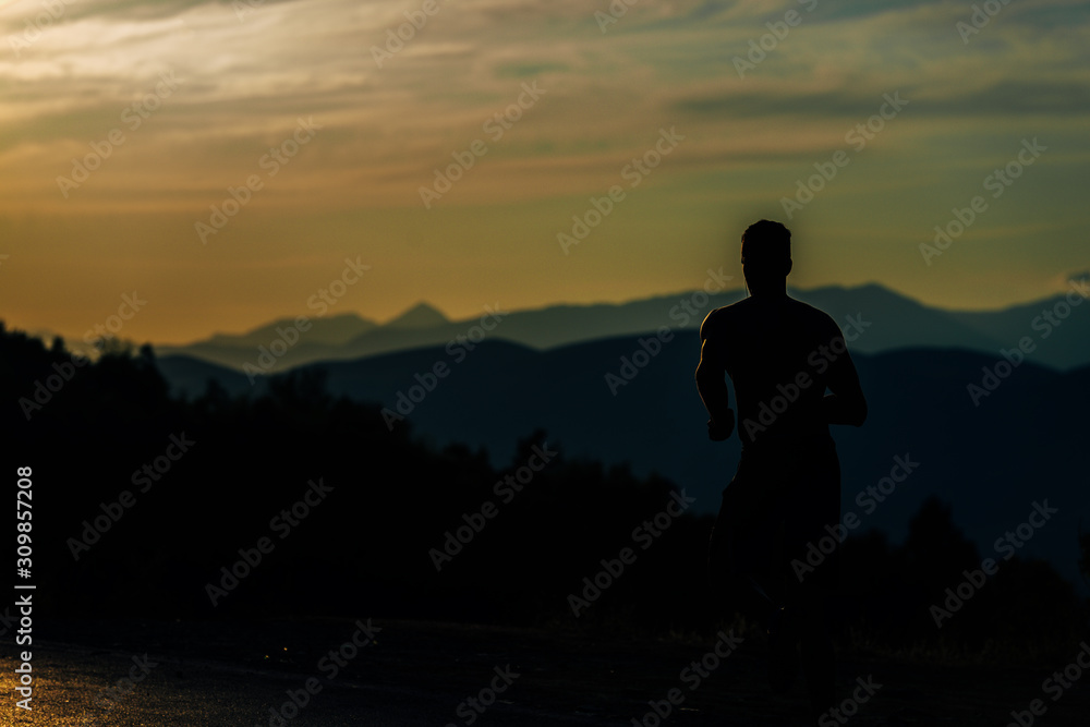 Silhouette man working out while training run exercise Silhouette man working out while training run exercise