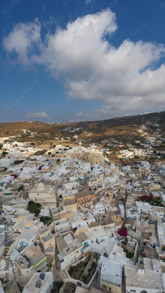 Aerial drone panoramic photo of small picturesque village of Emporeio in Santorini volcanic island, Cyclades, Greece