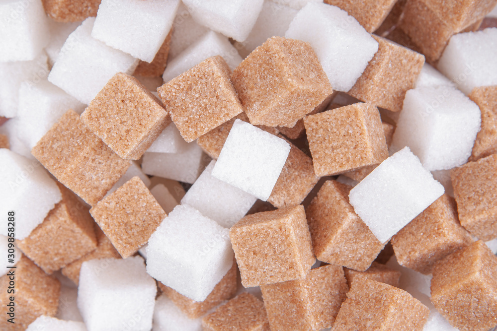 Cane sugar and white sugar cubes background top view texture Cane sugar and white sugar cubes background top view texture