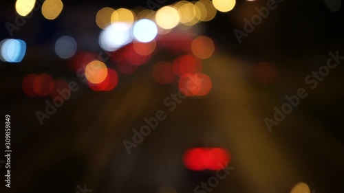 video of unfocused cars circulating at night on the road