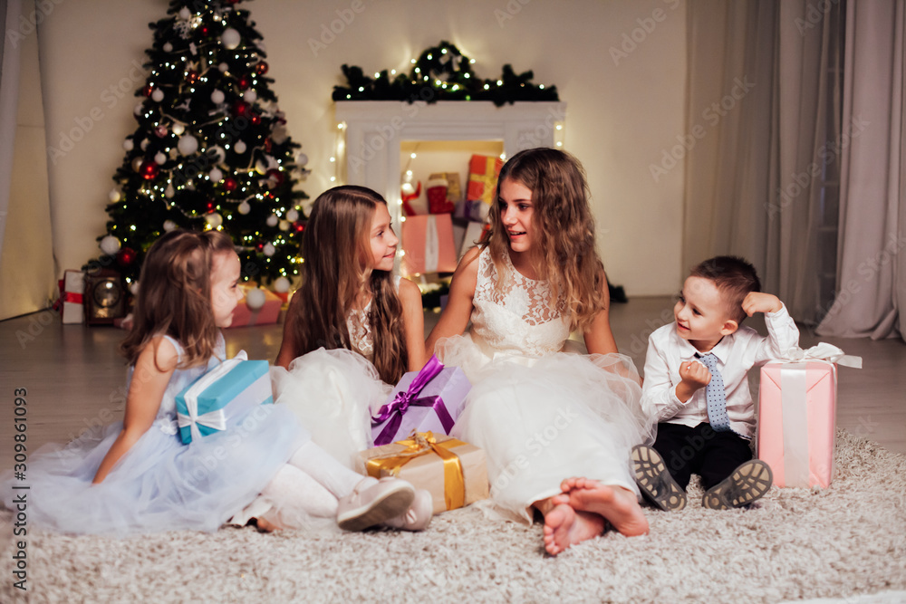 Kids open Christmas sparklers gift new year holiday lights Christmas tree garlands