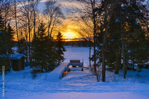 Winter landscape sunset frozen lake 