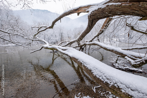 Cold winter day on the river. Winter landscape.
