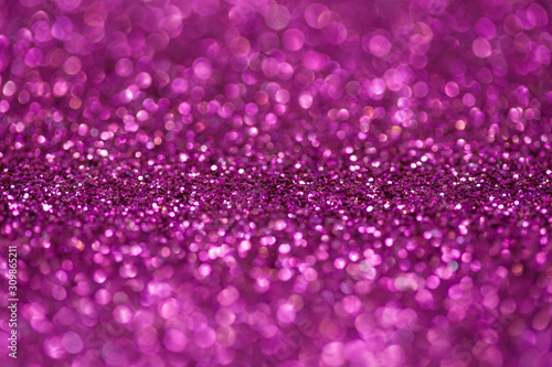 Pink and purple glitter, Defocused abstract holidays lights With Sparkle for background.