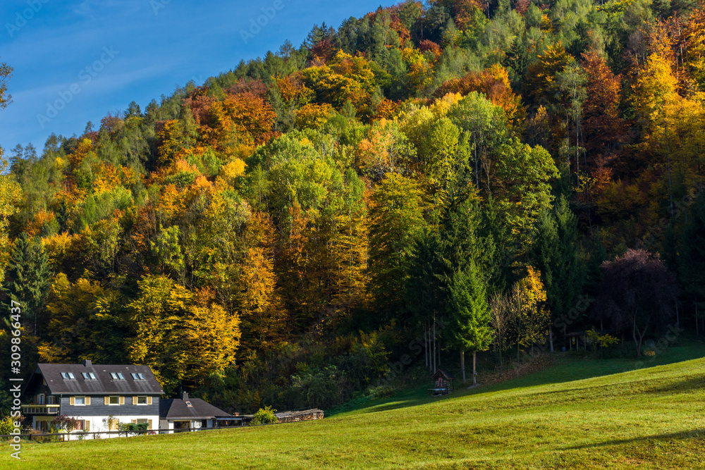 Autumn landscape with small house and colorful trees near Graz, Styria region, Austria Autumn landscape with small house and colorful trees near Graz, Styria region, Austria