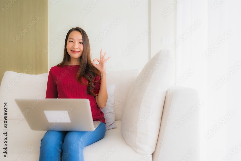 Portrait beautiful young asian women using computer laptop on sofa chair Portrait beautiful young asian women using computer laptop on sofa chair