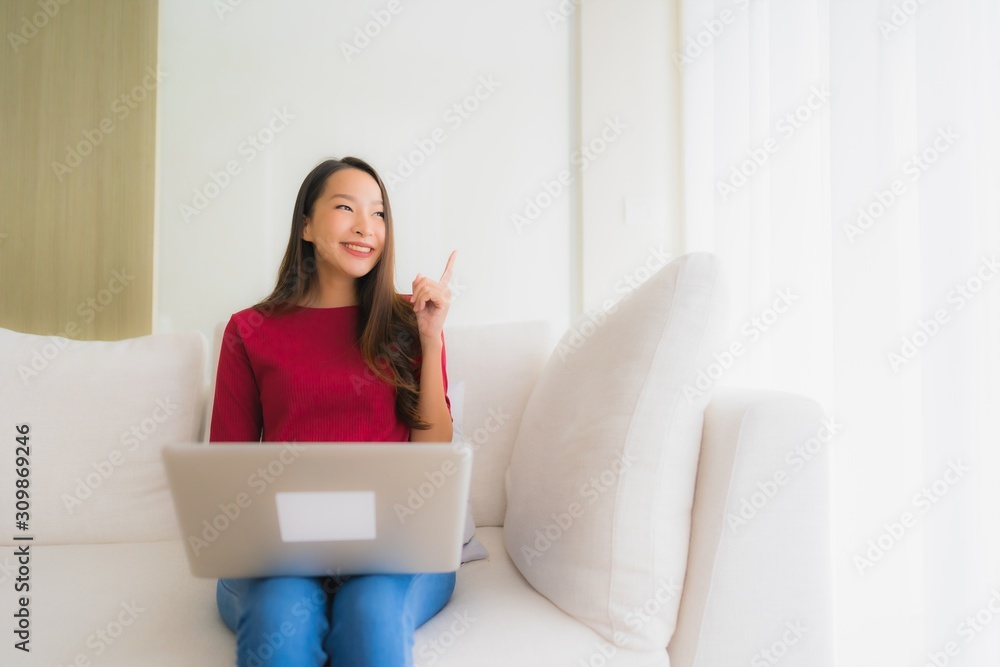 Portrait beautiful young asian women using computer laptop on sofa chair Portrait beautiful young asian women using computer laptop on sofa chair
