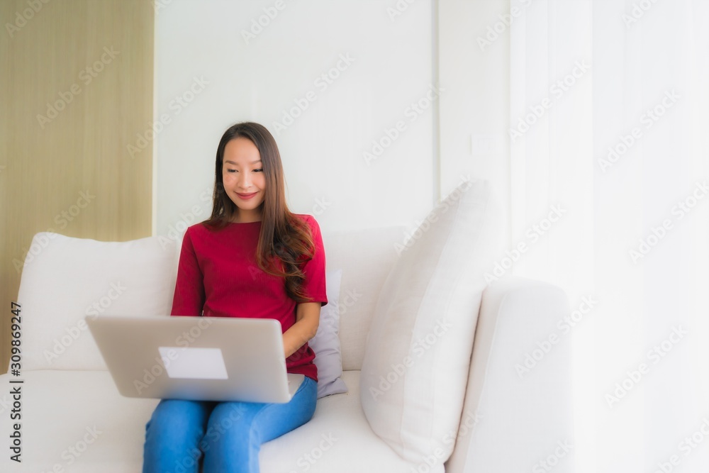 Portrait beautiful young asian women using computer laptop on sofa chair Portrait beautiful young asian women using computer laptop on sofa chair
