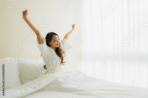 Wallpaper Mural Portrait beautiful young asian women smile happy on bed Torontodigital.ca