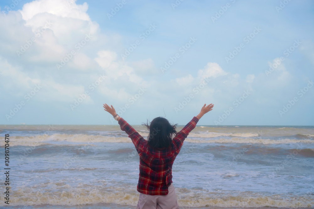 Woman rise hands up to sky freedom concept with blue sky. Woman rise hands up to sky freedom concept with blue sky.