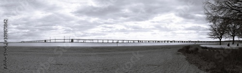 Black and white view of Chesapeake Bay Bridge as seen from the Sandy Point State Park in Maryland USA.