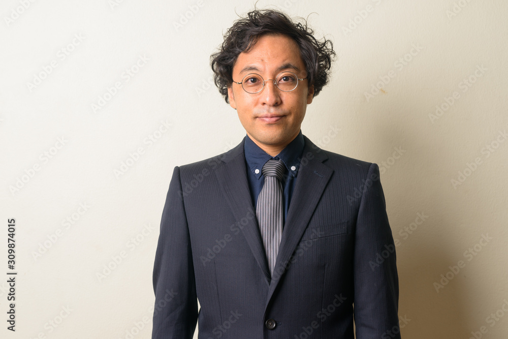 Face of Japanese businessman in suit with curly hair Face of Japanese businessman in suit with curly hair