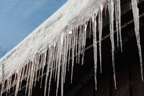 Icicles on roof in warm winter