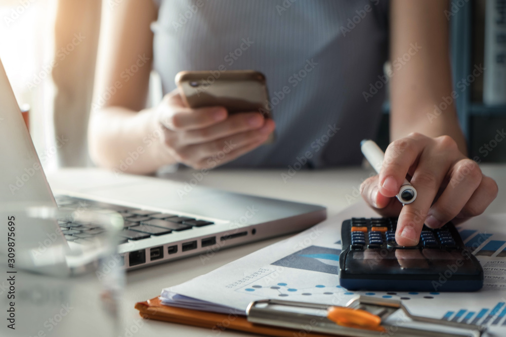 Fototapeta premium Business women doing finances and calculate on desk.