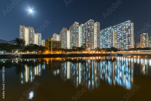 High rise residential building of public estate in Hong Kong city at night © leeyiutung