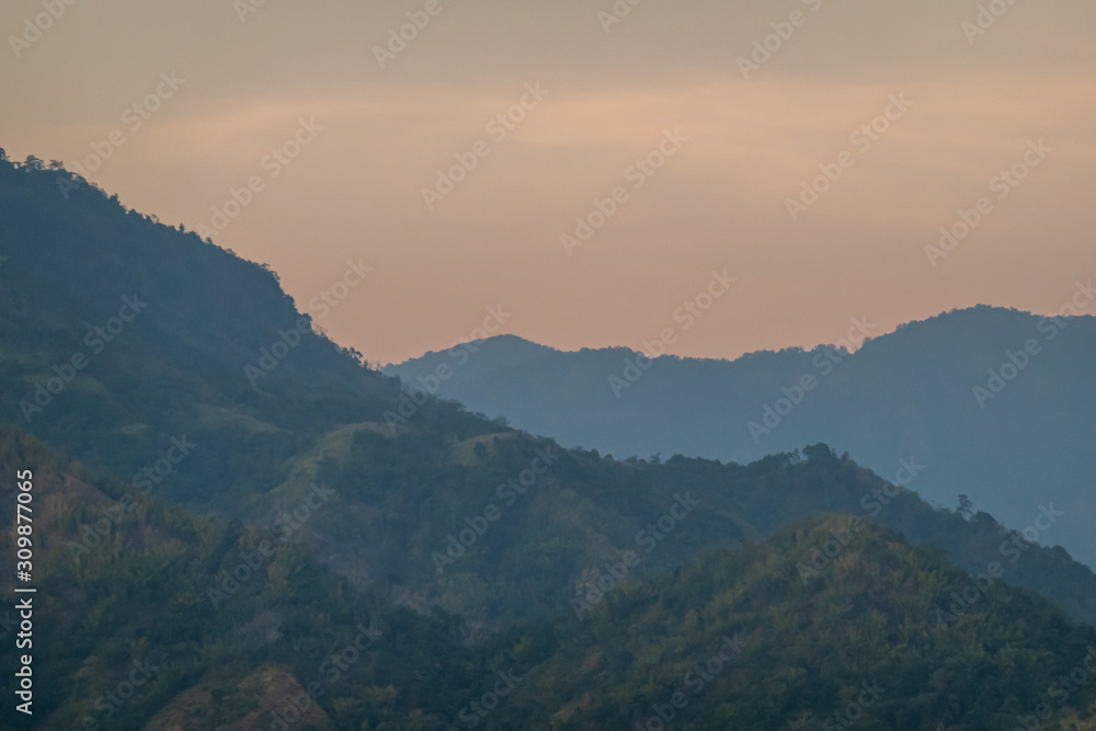 beautiful blue sky high peak mountains mist fog wildlife green forest at Khao Koh, Phu Tub Berk, Phetchabun, Thailand  guiding idea long weekend for backpacker camping campfire relaxing hiking