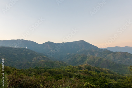 Wat Pha Sorn Kaew, Wat Phra Thart Pha Sorn Kaew, is a Buddhist temple with beautiful blue sky high peak mountains mist fog wildlife green forest at Khao Koh, Phu Tub Berk, Phetchabun, Thailand