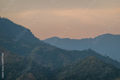 beautiful blue sky high peak mountains mist fog wildlife green forest at Khao Koh, Phu Tub Berk, Phetchabun, Thailand  guiding idea long weekend for backpacker camping campfire relaxing hiking © Tony